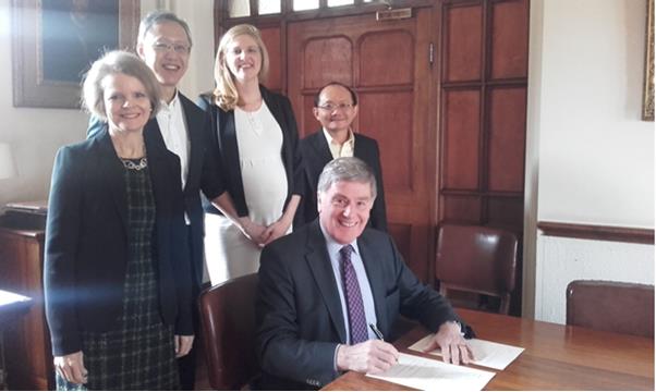 Signing the memorandum in the SCR at Harris Manchester College. From left: Professor Louise Gullifer, Professor Tan Cheng Han, Dr Kristin van Zwieten, Associate Professor Wee Meng Seng.  Seated: Dr Ralph Waller, Principal of Harris Manchester College